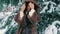Brunette rich woman waist coat of brown fur on background of Christmas tree slow motion
