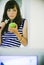 Brunette standing/eating apple