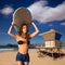 Brunette surfer teen girl holding surfboard in a beach