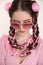 Brunette teen girl braided with two french braids from pink kane