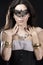 Brunette with venetian mask. Jewelry and Beauty. fashion photo