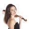 Brunette with violin on shoulder in studio