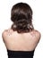 Brunette woman from backside on gray background