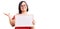 Brunette woman with down syndrome holding empty white chalkboard celebrating victory with happy smile and winner expression with