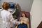 Brunette woman is examined by doctor, undergoes ultrasound examination of abdominal cavity and small pelvic organs on modern