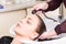 Brunette Woman Having Hair Washed in Salon