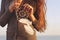 Brunette woman with long hair holding dream catcher