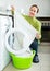 Brunette woman near washing machine