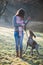 Brunette woman posing with her adorable German pointer dog