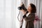 A brunette woman working photographer. photo shoot in a photo studio. backstage