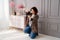 A brunette woman working photographer. photo shoot in a photo studio. backstage