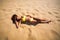 Brunette woman yellow swimsuit beach