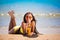 Brunette woman yellow swimsuit drink cocktail