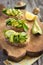 Bruschetta with avocado, arugula, lemon and pine nuts