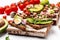 Bruschetta collection with tuna, quail egg, cherry tomatoes, avocado, microgreen and capers, Tasty tuna sandwiches. Food recipe