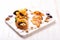 Bruschetta with cream cheese, pear, honey, basil on marble table