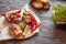 Bruschetta with fish, meat, vegetables and cheese on a wooden Board. Traditional Italian appetizer or appetizer, antipasto