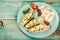 Bruschetta with grilled cheese halumi on a wooden background. Preparation of cheese Halumi. Cheese Halumi with mint