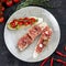 Bruschetta with meat, fish and tomatoes
