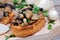 Bruschetta with mushroom and garlic on chopping board