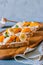 Bruschetta with peach and apricot fruit, salted feta cheese
