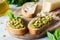 Bruschetta with pesto and pine nuts. Vegetarian appetizer