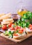 Bruschetta with ricotta, spinach, corn salad and cherry tomatoes