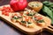 bruschetta with spinach and artichoke on a bamboo board