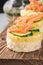 Bruschetta toast of white bread with slices of pineapple cucumber fish salmon fresh green sprouts