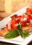 Bruschetta with tomato, mozzarella and basil