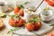 Bruschetta with tomatoes, arugula, olive oil and cheese on white tray on textured background. Fresh italian toasts