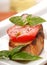 Bruschetta topped with fresh tomato and basil