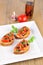 Bruschetta on wooden table and white plate with chilioil 3