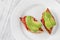 Bruschettas with tomato spread and avocado