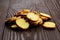 Bruschette chips, slices of baked bread, heap of dry snacks on wooden background