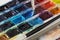 Brush and professional colorful watercolor paints closeup