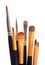 Brushes for applying makeup on lips and eyes close-up on white isolated background