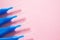 Brushes for braces, toothbrushes for interdental spaces on pink background. Close up. Macro. Copy space