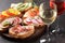 Brushetta or spanish tapas set with wine