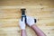 The brushing process of wooden plank. Male hand is holding brushing machine electrical rotating with brush metal disk sanding a