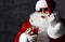 Brusque Santa Claus in aviator sunglasses is eating red caviar fish salmon. New year and Merry Christmas  concept