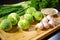 brussel sprouts prepped for grilling on a chopping board