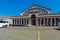 BRUSSELS, BELGIUM - APRIL 5, 2008: Tourists walk in front of Entrance to the Palais Mondial (South Hall)