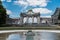 Brussels - Belgium - The cinquantenaire city park with a fountain, colorful flowers and the symbolic arcades in the background