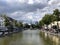 Brussels, Belgium - June 15, 2019: Jules Anspach fountain and Quai aux Briques in a bright cloudy day of summer