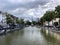 Brussels, Belgium - June 15, 2019: Jules Anspach fountain and Quai aux Briques in a bright cloudy day of summer