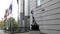 BRUSSELS, BELGIUM - OCTOBER, 13, 2017: statue europe and flags outside eu parliament in brussels