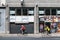 Brussels city center, Brussels Capital Region - Belgium - Facade of the Touring car lobby with two bicycles passing by