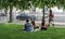 Brussels City Center, Brussels Capital Region, Belgium - Young girls sitting in the park during lunchtime