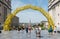 Brussels Old Town - Belgium - Tourists walking through the yellow arcades of the Le Grand depart yellow arcade of the Tour de